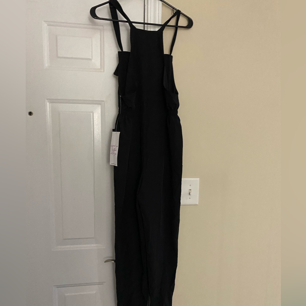 NEW WITH TAG!! VANILLA STAR BLACK ROMPER! SIZE S.